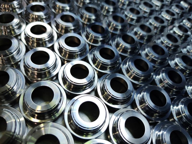 A batch of precision-turned steel parts.