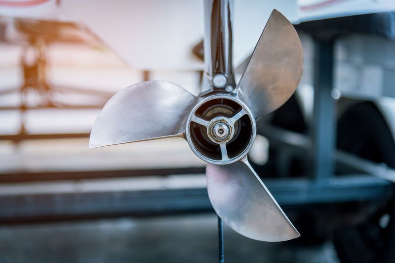 Close-up of a stainless steel boat propeller.
